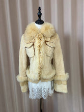 Vintage cream-colored genuine fur coat