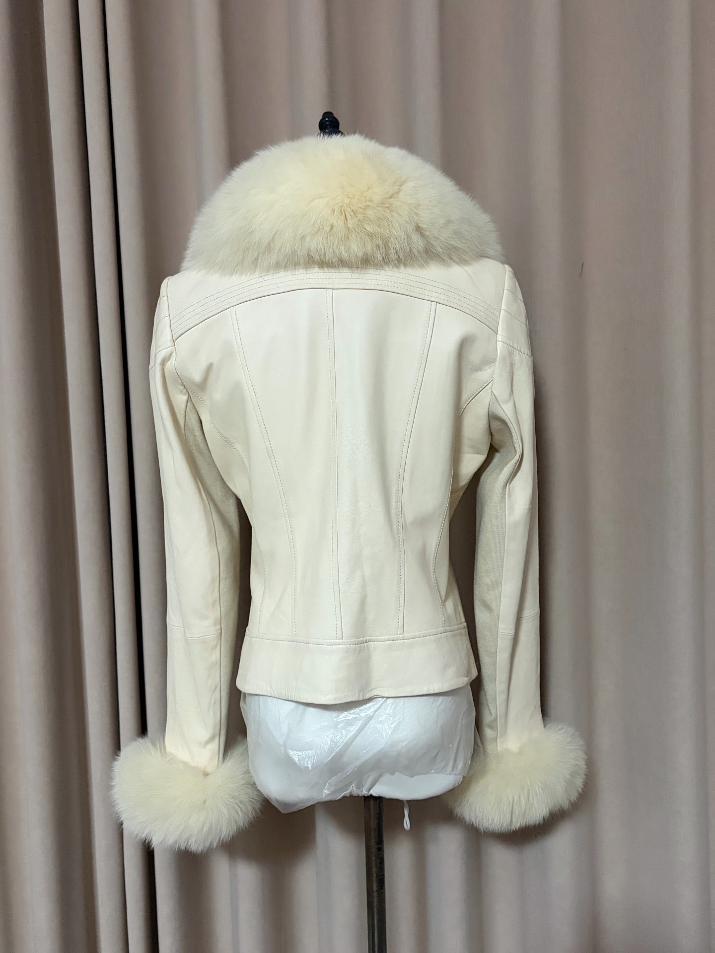 Vintage off-white leather jacket with a real fur collar