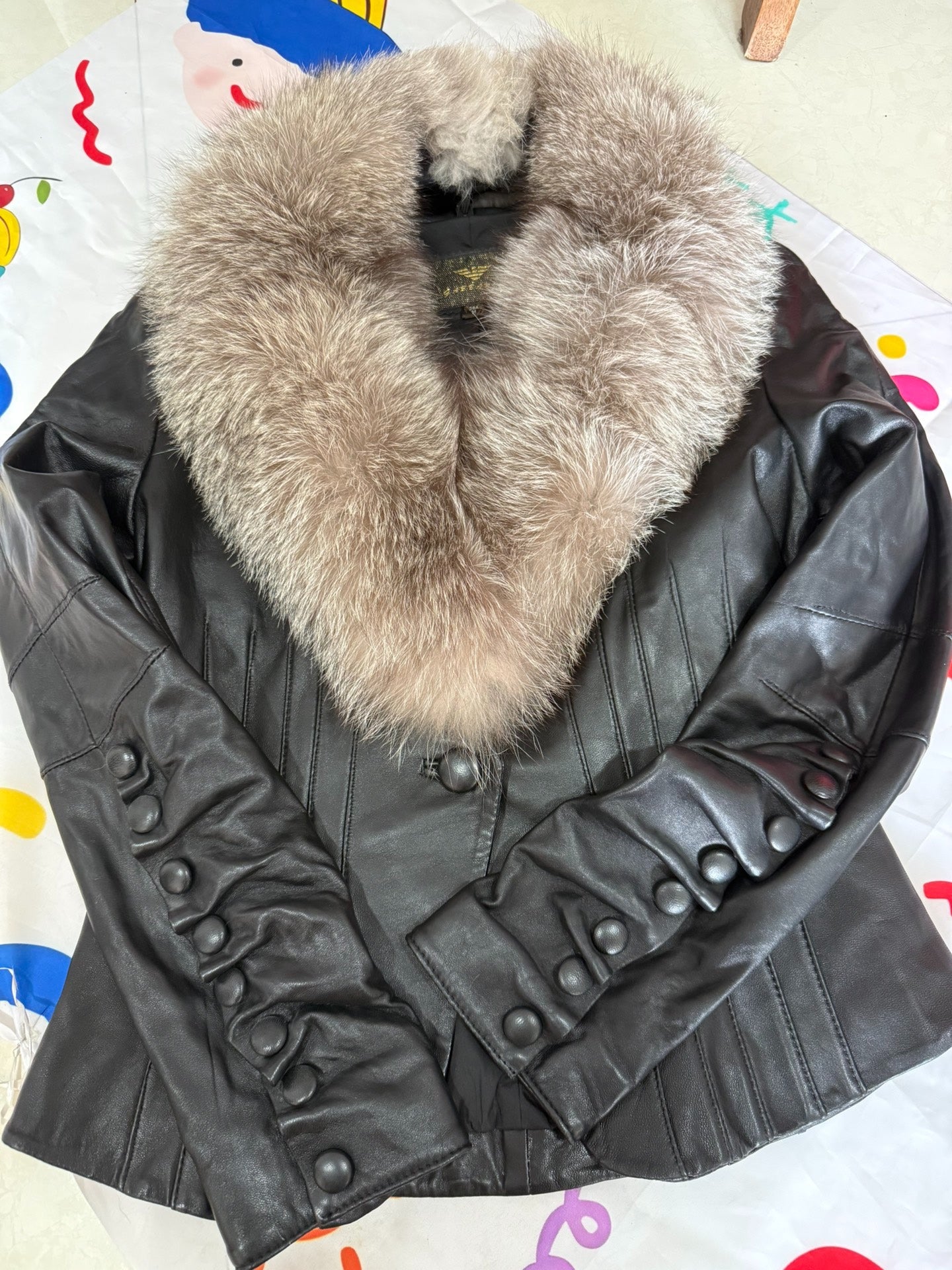 Vintage black leather jacket with fox fur collar
