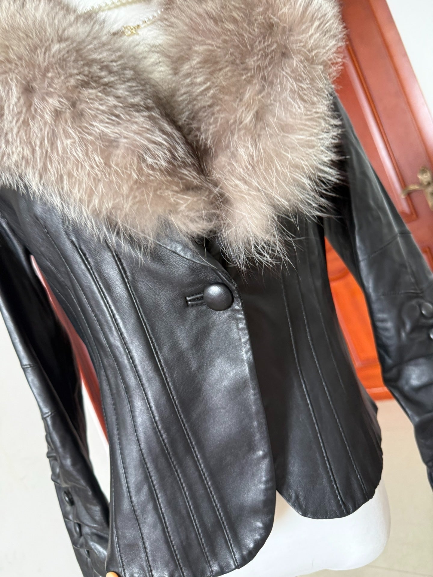 Vintage black leather jacket with fox fur collar