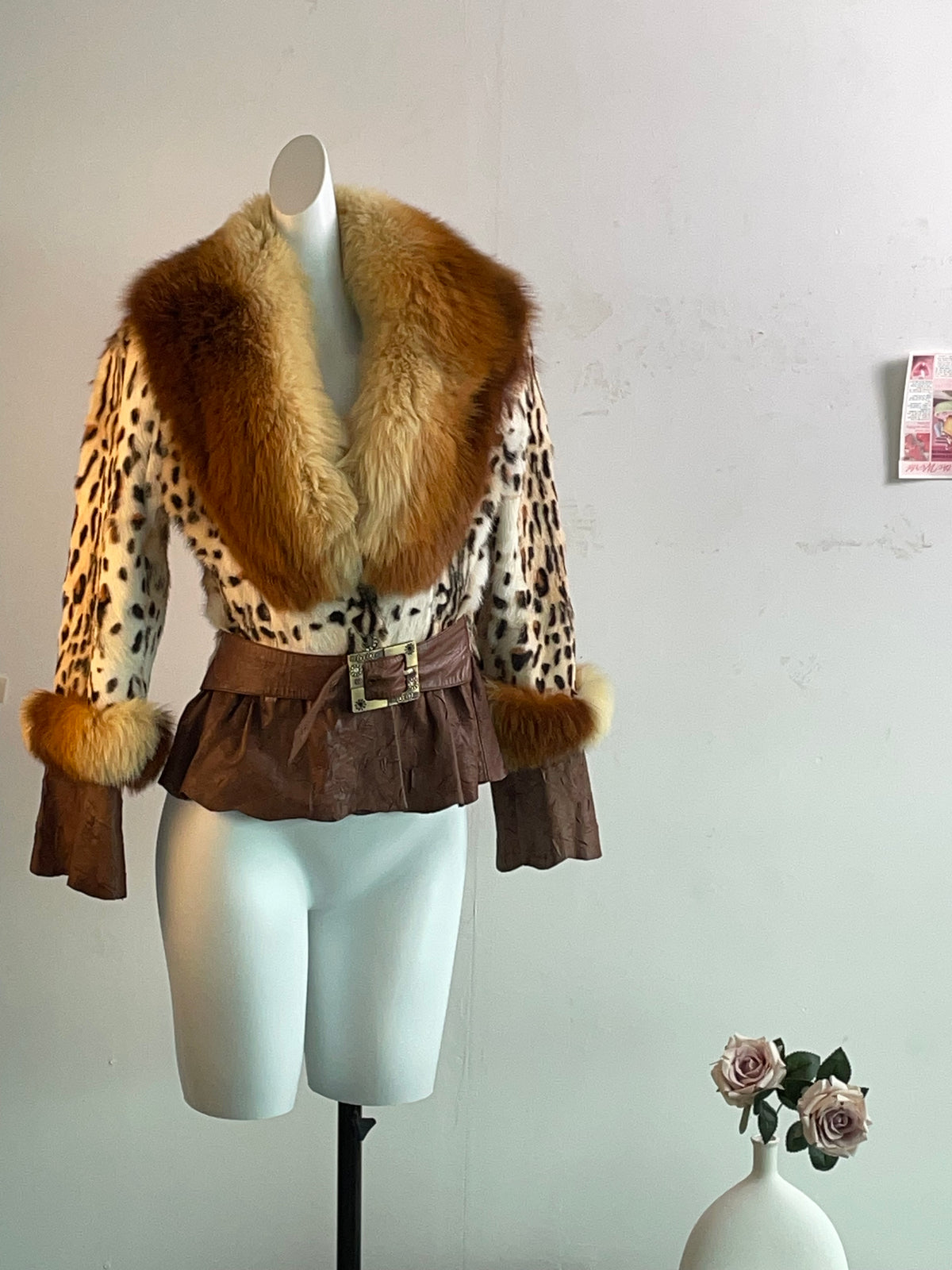 Vintage-style patchwork sheepskin fur coat featuring a distinctive leopard-print fox fur design, color-sprayed finish, and pintuck detailing.